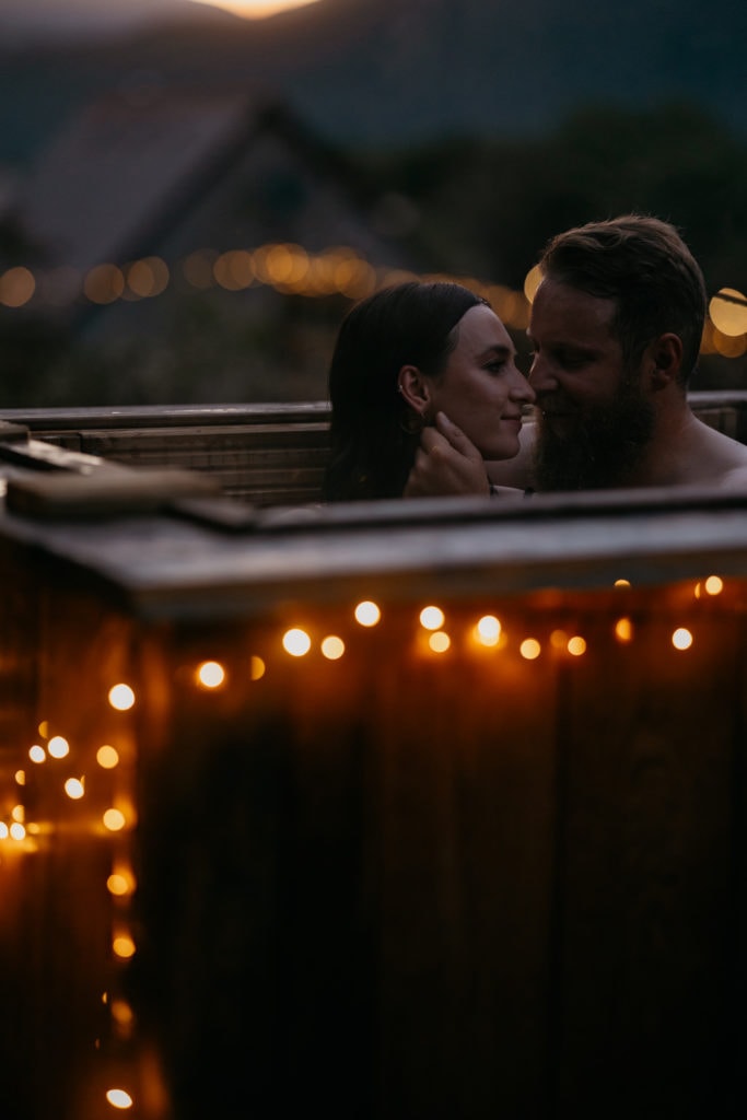 Couple in hot tub with Fairy lights 