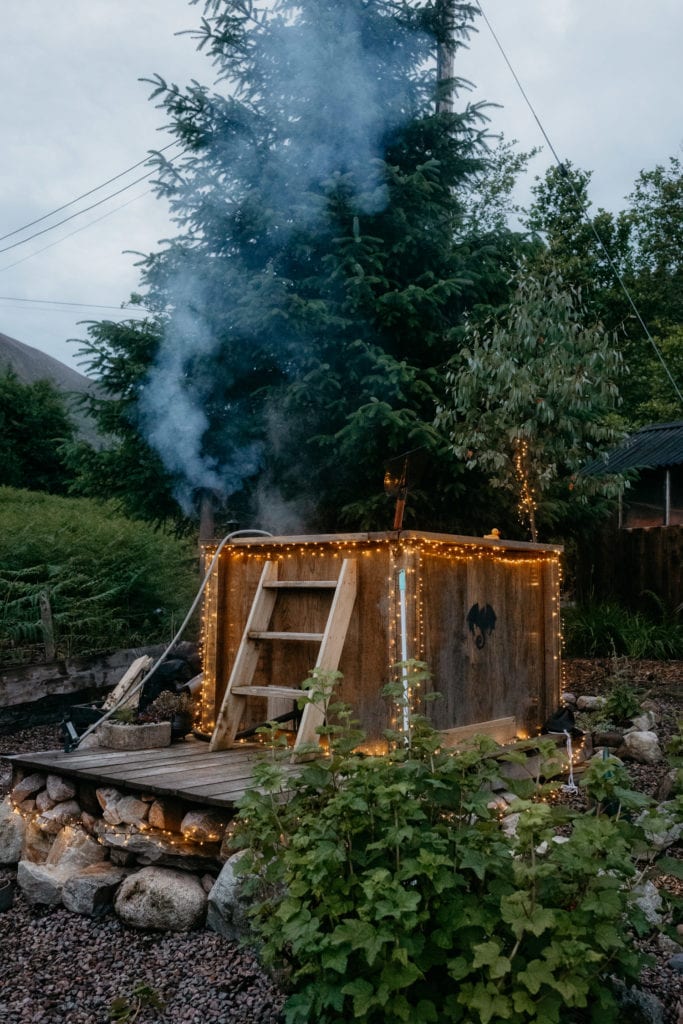 A wood fired hot tub with fairy lights Dragons Den Glencoe
