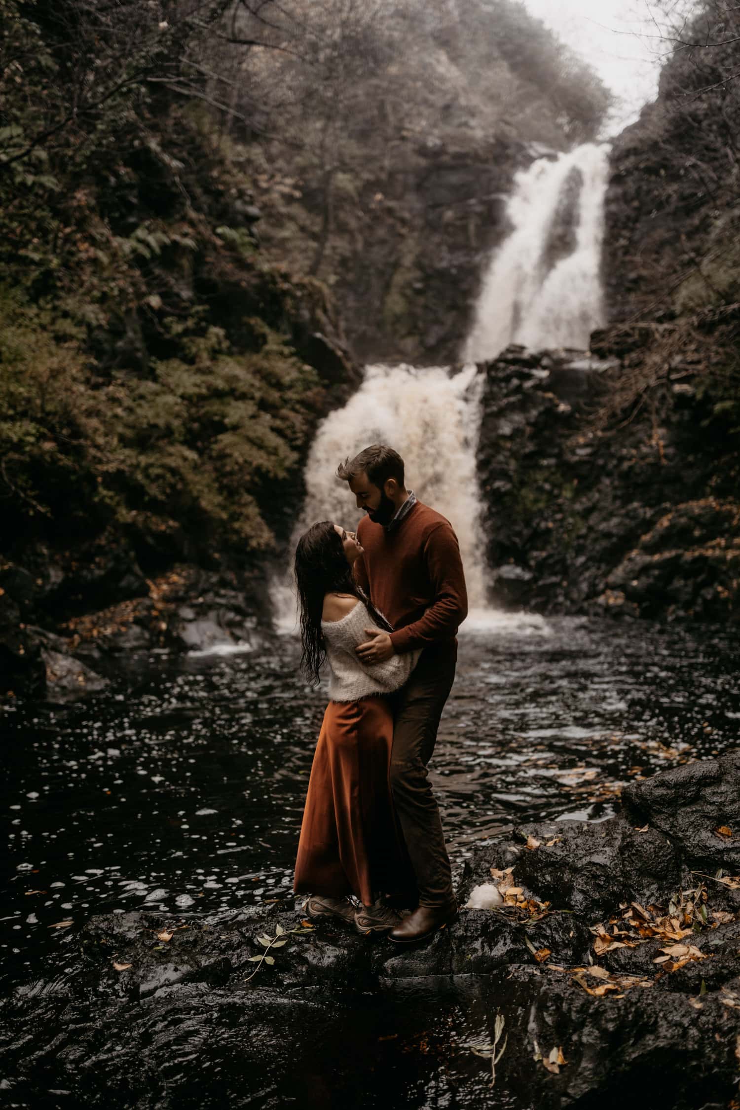 Couple by waterfall Isle of Skye 