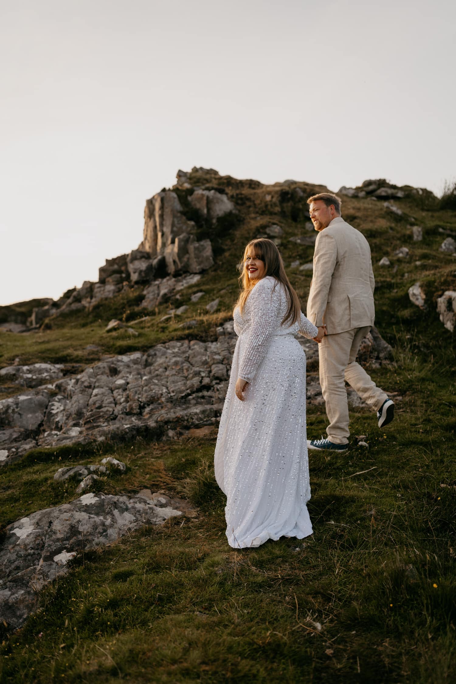 elopement couple walking to dunscaith castle
