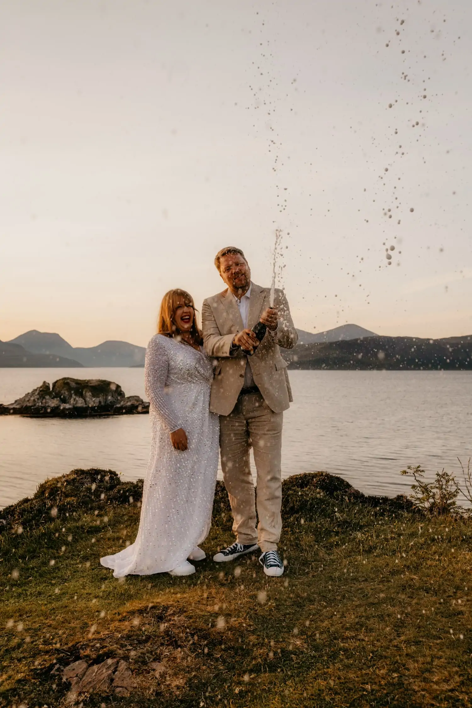 champagne spray at Dunscaith castle elopement