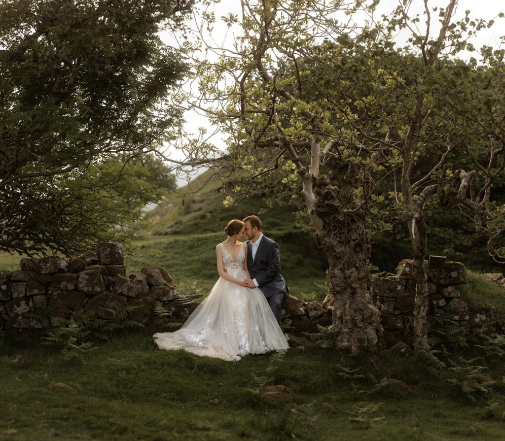 Celeste and Doug share an intimate moment at Fairy Glen, Isle of Skye while perched atop a branch of a tree