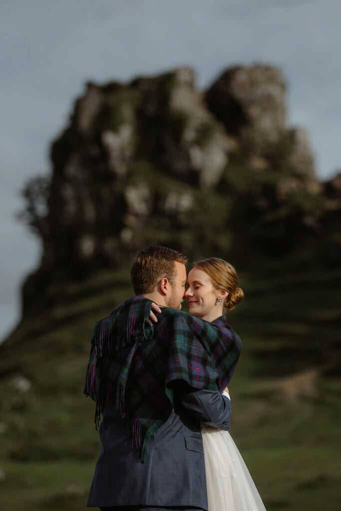 Celeste and Doug in Scotland's Fairy Glen on the Isle of Skye, admiring the lush landscape.