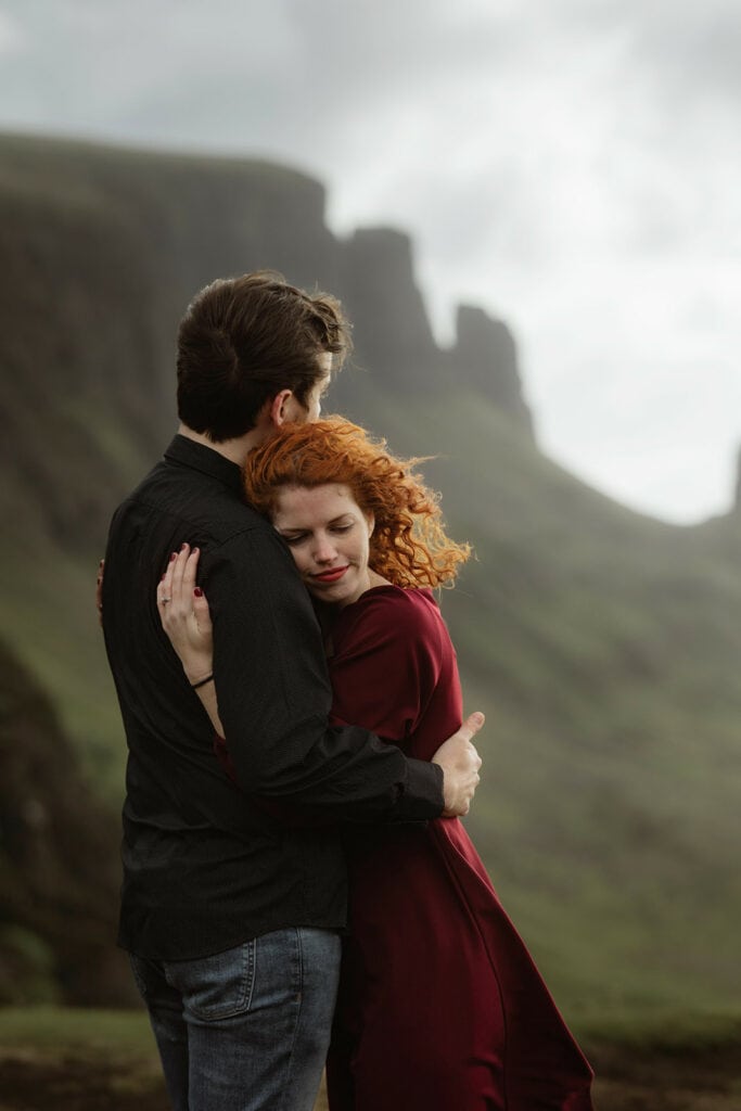Ashley and Bobby share a romantic moment while embracing each other in the spectacular landscape of Quiraing, Isle of Skye