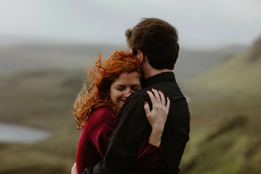 Ashley and Bobby share a romantic moment while embracing each other in the spectacular landscape of Quiraing, Isle of Skye